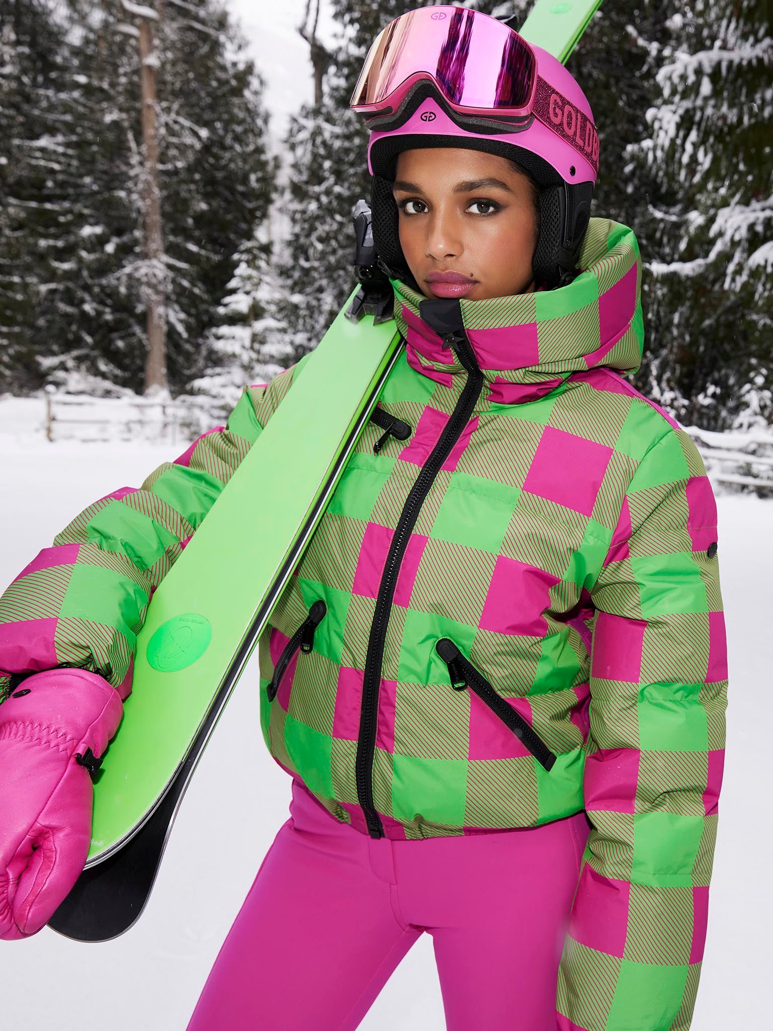 Pink and store green ski suit